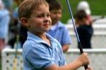 Young Boy Satisfied with Golf Swing